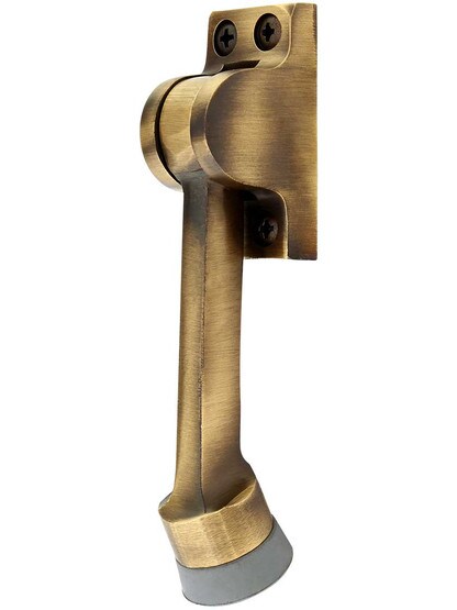 4 inch Solid Brass Kickdown Door Holder in Antique Brass.